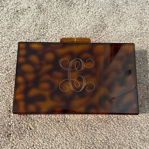 Monogrammed tortoise shell clutch
